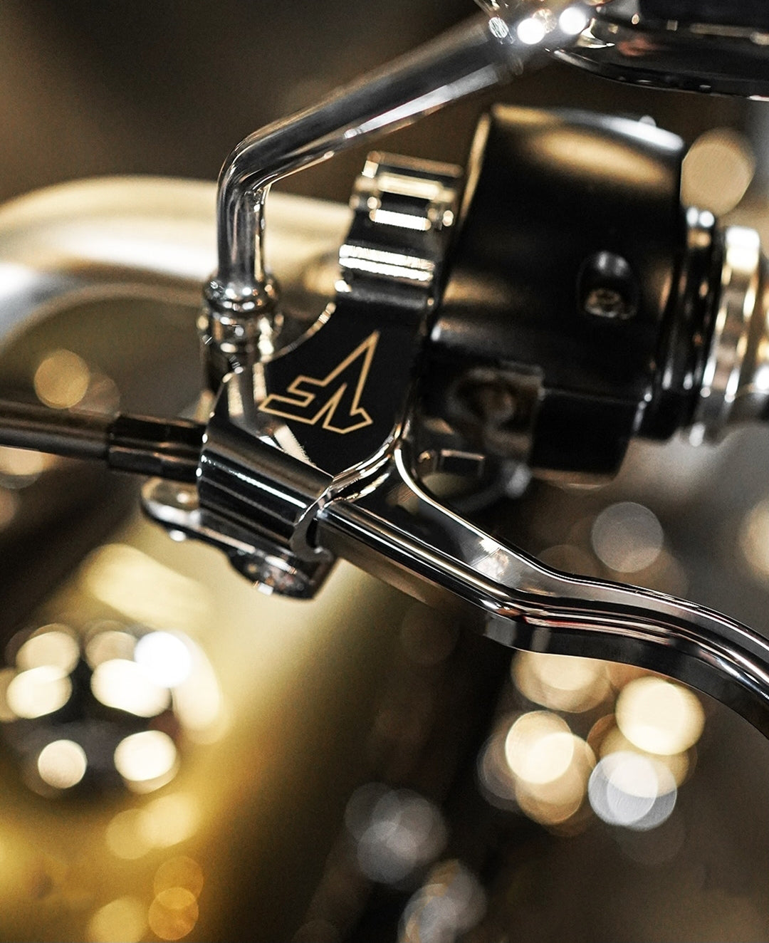 Close up of Chrome 1FNGR easy pull clutch lever for Harley Davidson on a handlebar